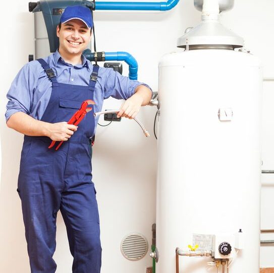 17184273 – smiling technician repairing an hot-water heater